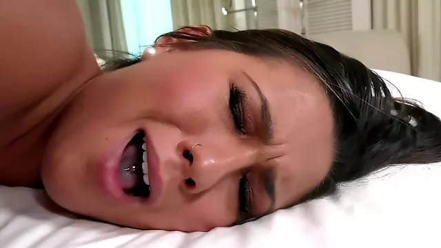 A girl with a sexy cunt is on the bed, feeling some love inside her