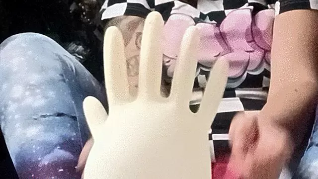 pop pink balloons and medical gloves