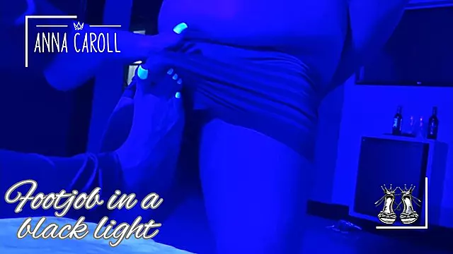 Foot fetish in a motel with black light.