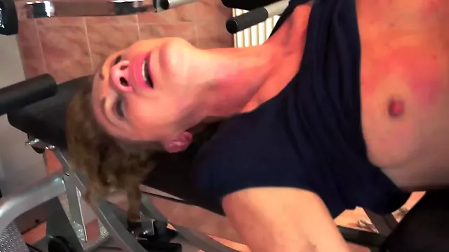 A nasty granny is getting her ass fingered in this video