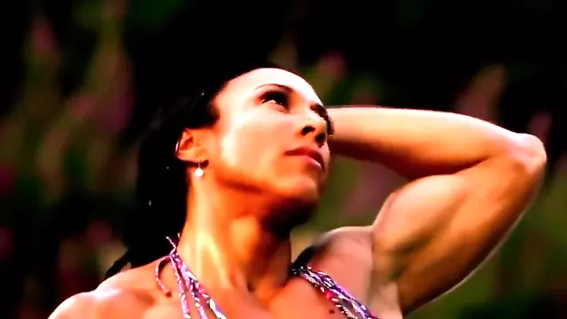 Muscle woman flexing hard