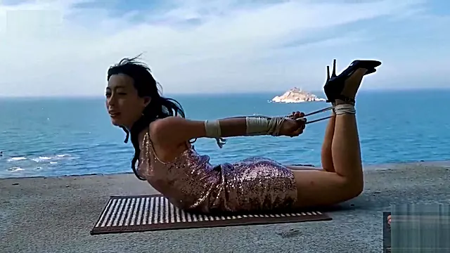 Chinese girl public bondage seaside