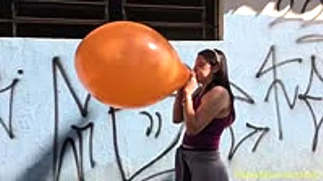 Laura Blows to Pop an Orange 17-Inch Tuf-Tex
