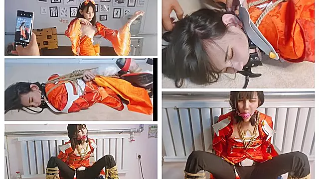 Wearing a cosplay costume with a gag to control breathing and bound to a chair she was subjected to BDSM with copious amounts of saliva drooling from her mouth