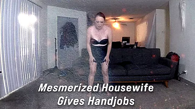 Mesmerized housewife gives handjobs 2