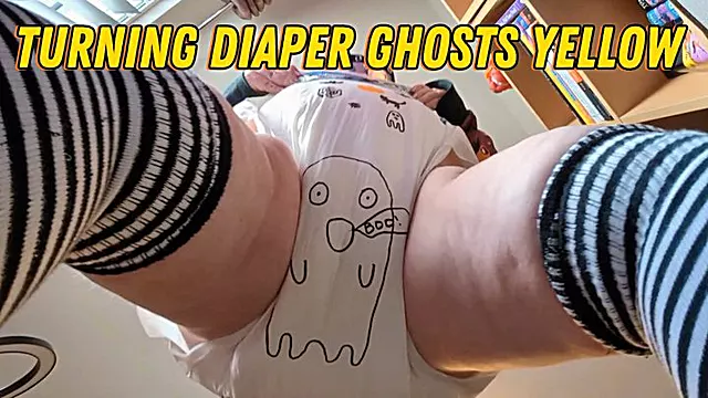 Daisy gives her diaper a Halloween makeover and turns her ghost yellow