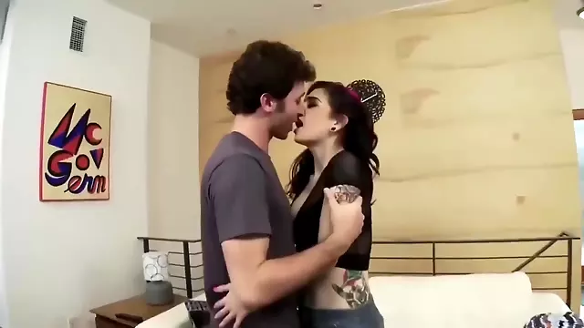 Tattooed pale girl in heels analyzed