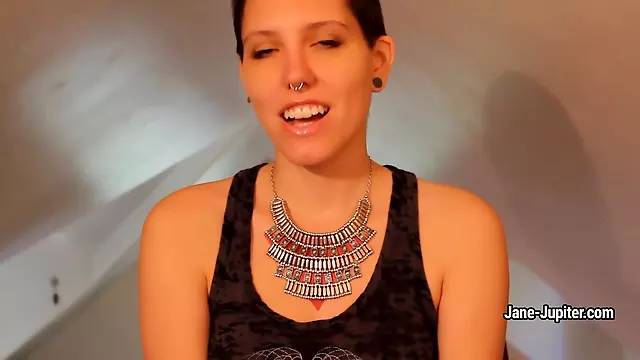 Jane Jupiter shows her pierced tits and hairy arm-pits