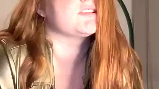 Voluptuous Redhead Bounces Huge Tits on Dildo
