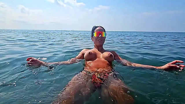 Brazen And Sex-Obsessed Stepmother Strips Naked And Shows Stepson Her Big Tits On A Public Beach