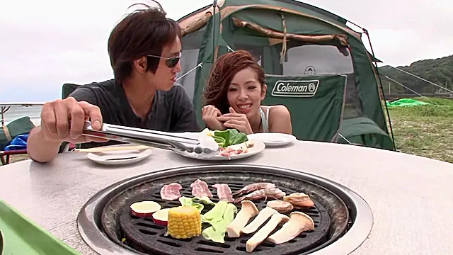 Asian couple having some freaky outdoor sex