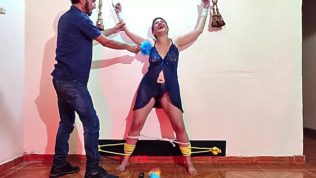Man ties sensual and daring woman with rope and tickles her and masturbates at the same time