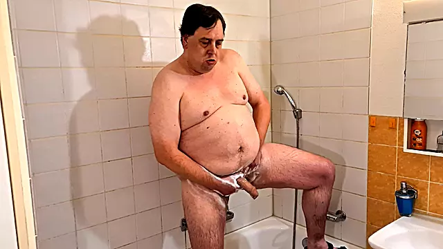 A Chubby Guy Kneads His Cock in the Shower